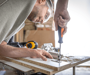 screwing-self-tapping-screw-into-metal-fastening-hole-wood-strip-using-screwdriver-work-carpenter 2 screwing-self-tapping-screw-into-metal-fastening-hole-wood-strip-using-screwdriver-work-carpenter 2