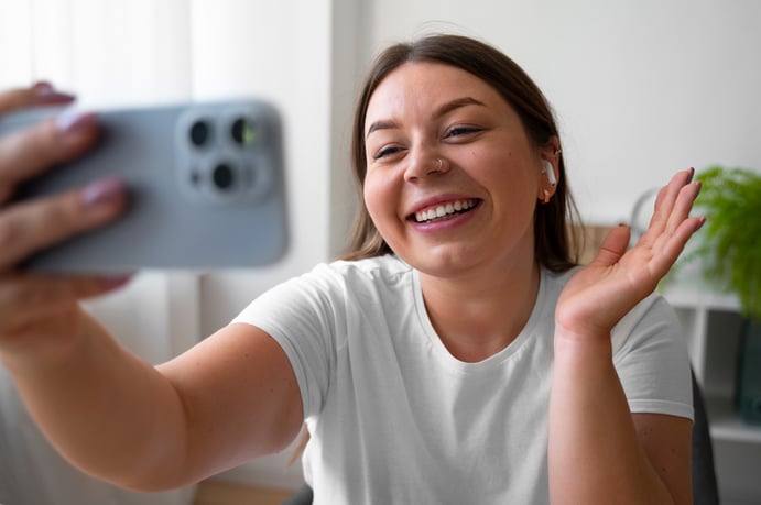 woman-having-video-call-home-with-smartphone-device