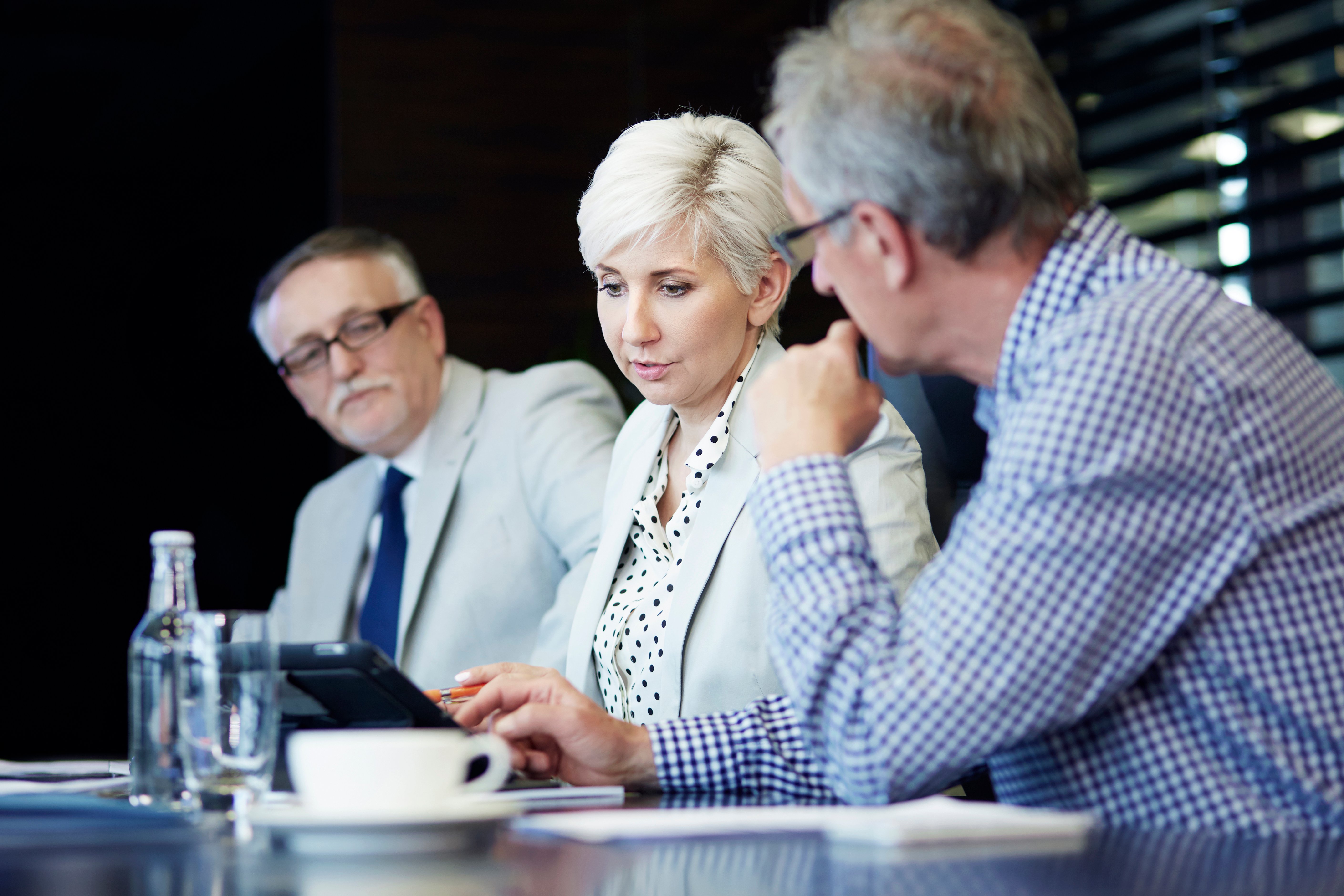 woman-presenting-project-digital-tablet