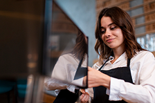 woman-smiling-working-coffee-machine 2